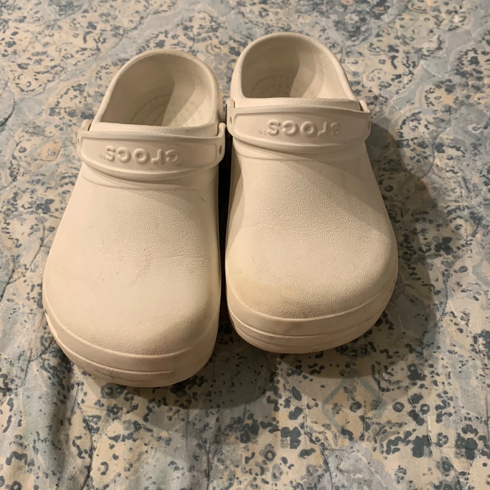 Croc’s all white closed toed clogs.